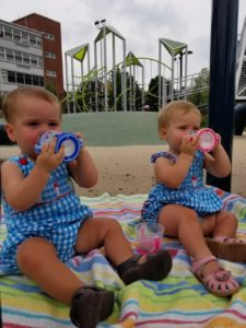 Twins drink from nuk sippy cups