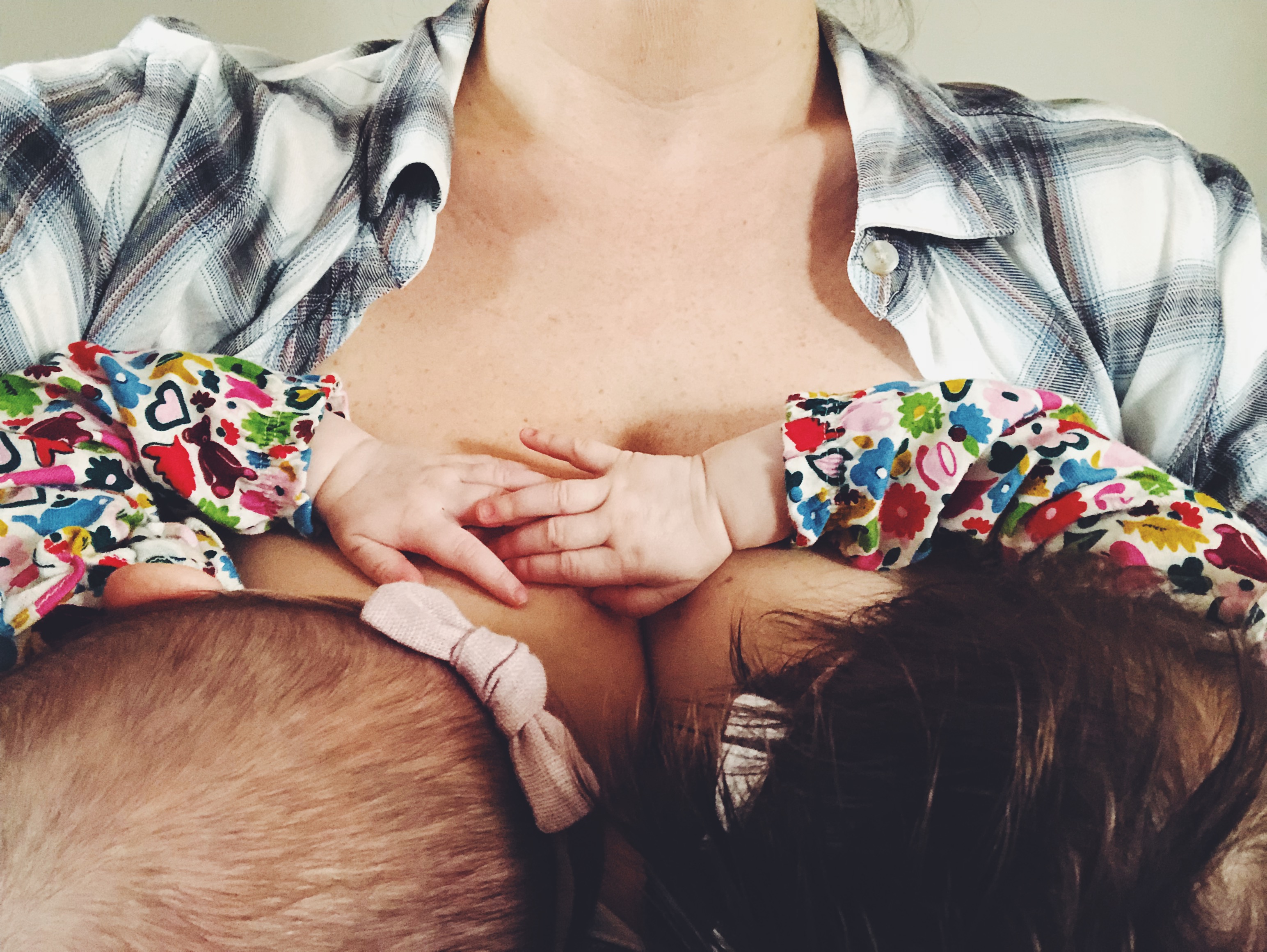 Selfie of Mother Breastfeeding Twins