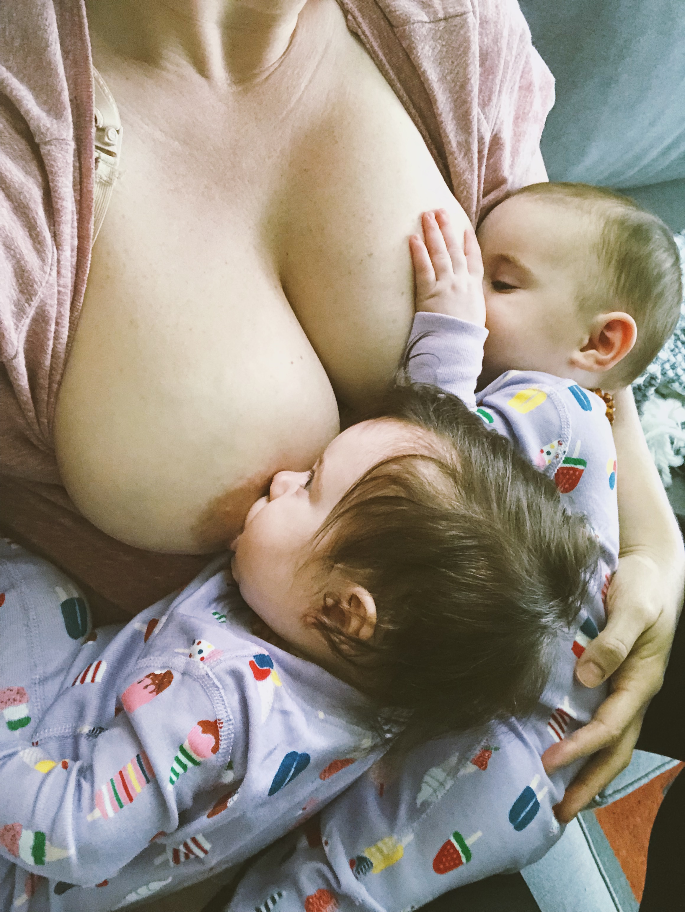 Breastfeeding Twins wearing matching PJs