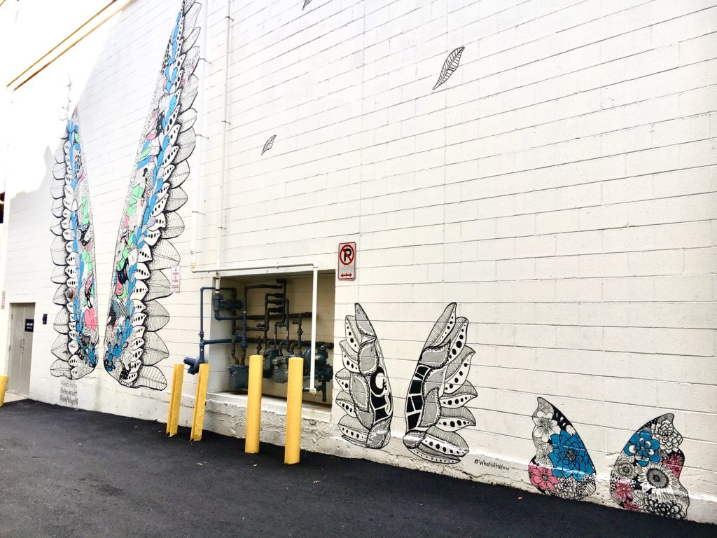 An alleyway in Bethesda Row is the location of three pairs of painted wings, which are part of the What Lifts You series by artist Kelsey Montague.