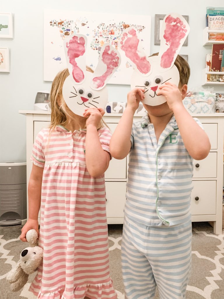 Twins show off footprint Easter bunny craft.