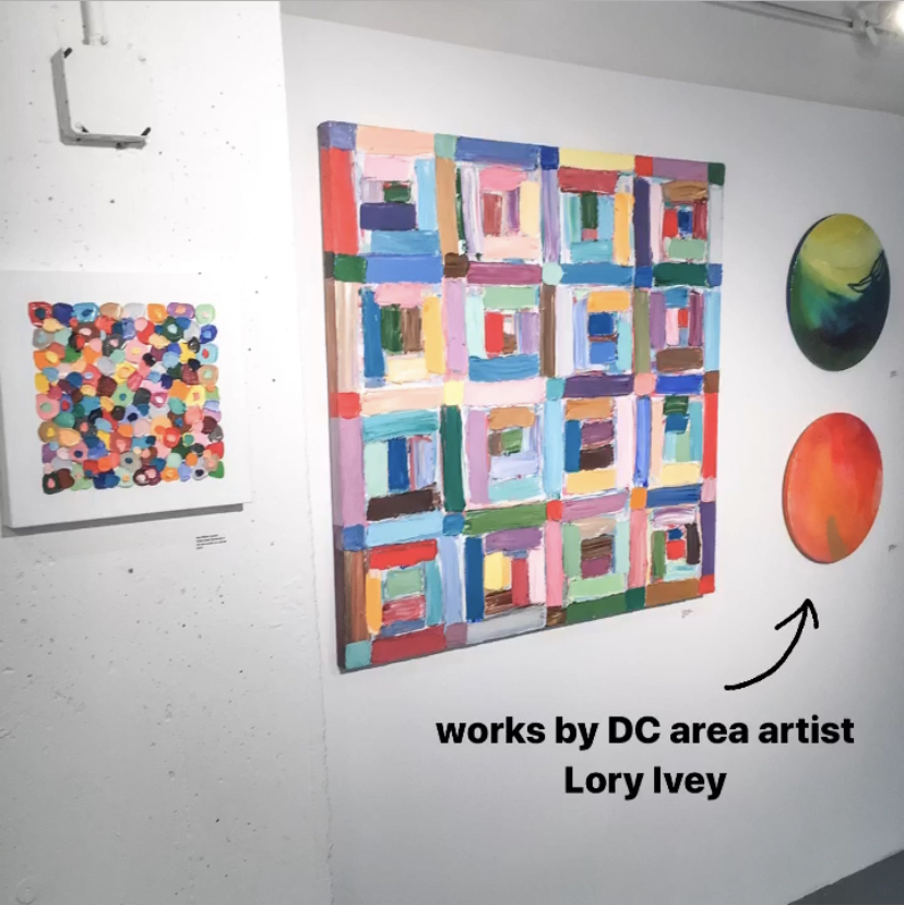 A colorful grouping of contemporary paintings by Lory Ivey Alexander Anne Marie Coolick on display in a gallery.