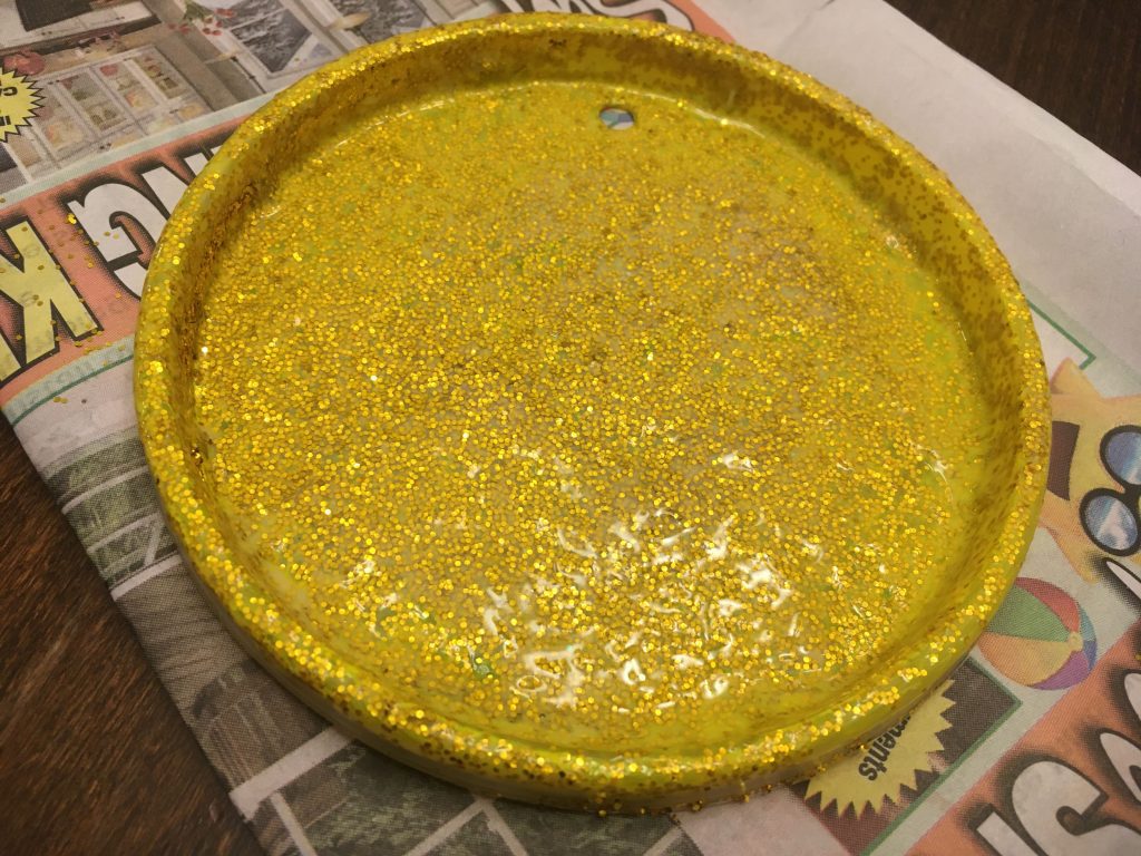 Paint over the glitter with glue