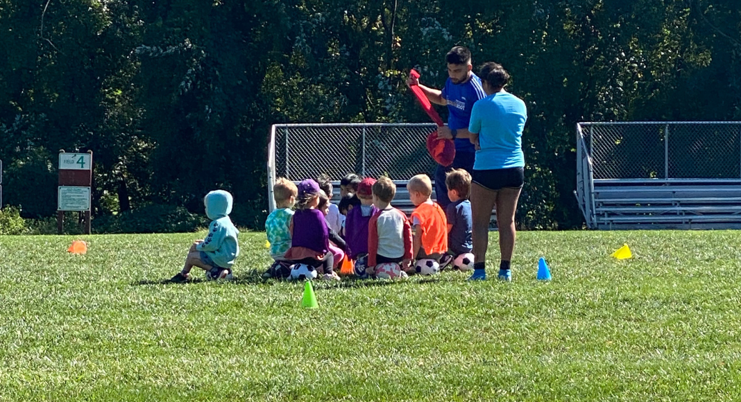 Children playing soccer as a highly sensitive person raising a highly sensitive child