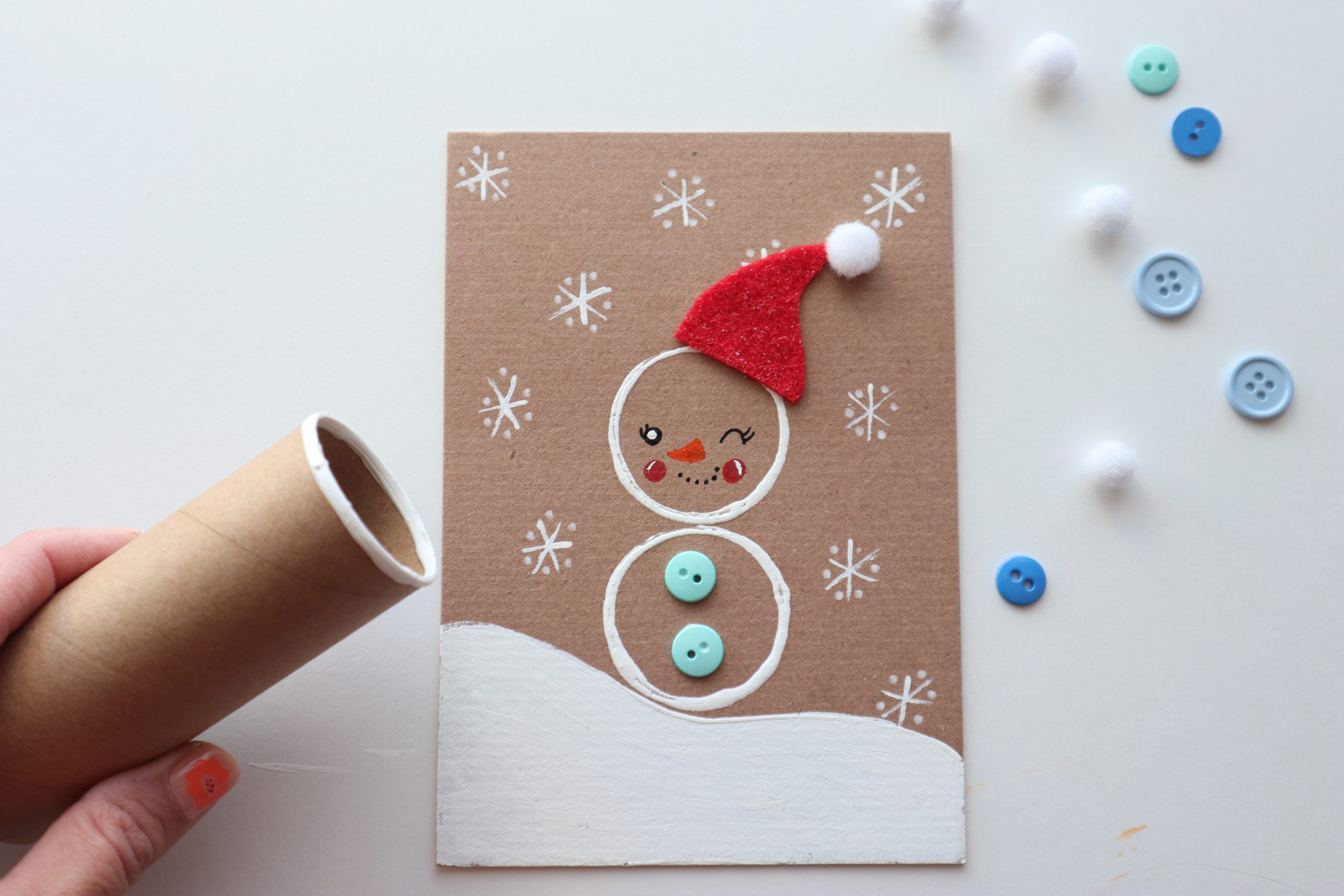 Snowman made with paper roll stamps
